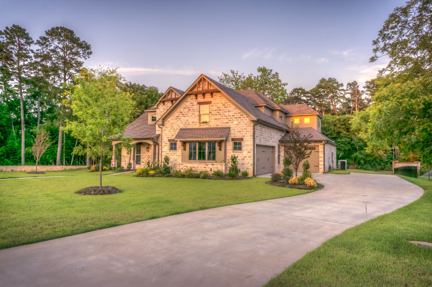Utah-style suburban home exterior with landscaping and a lawn